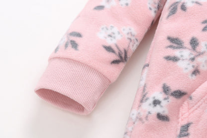 Detalle puño elástico rosa manga larga floral