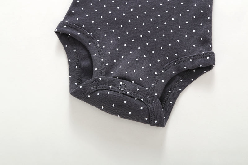 Detalle snap body gris lunares